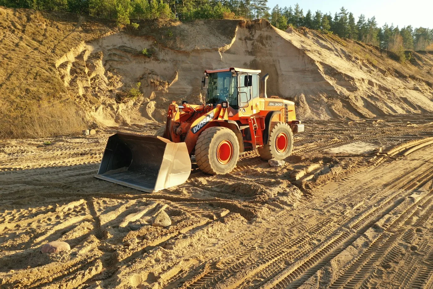 Loader shaping an exposed slope