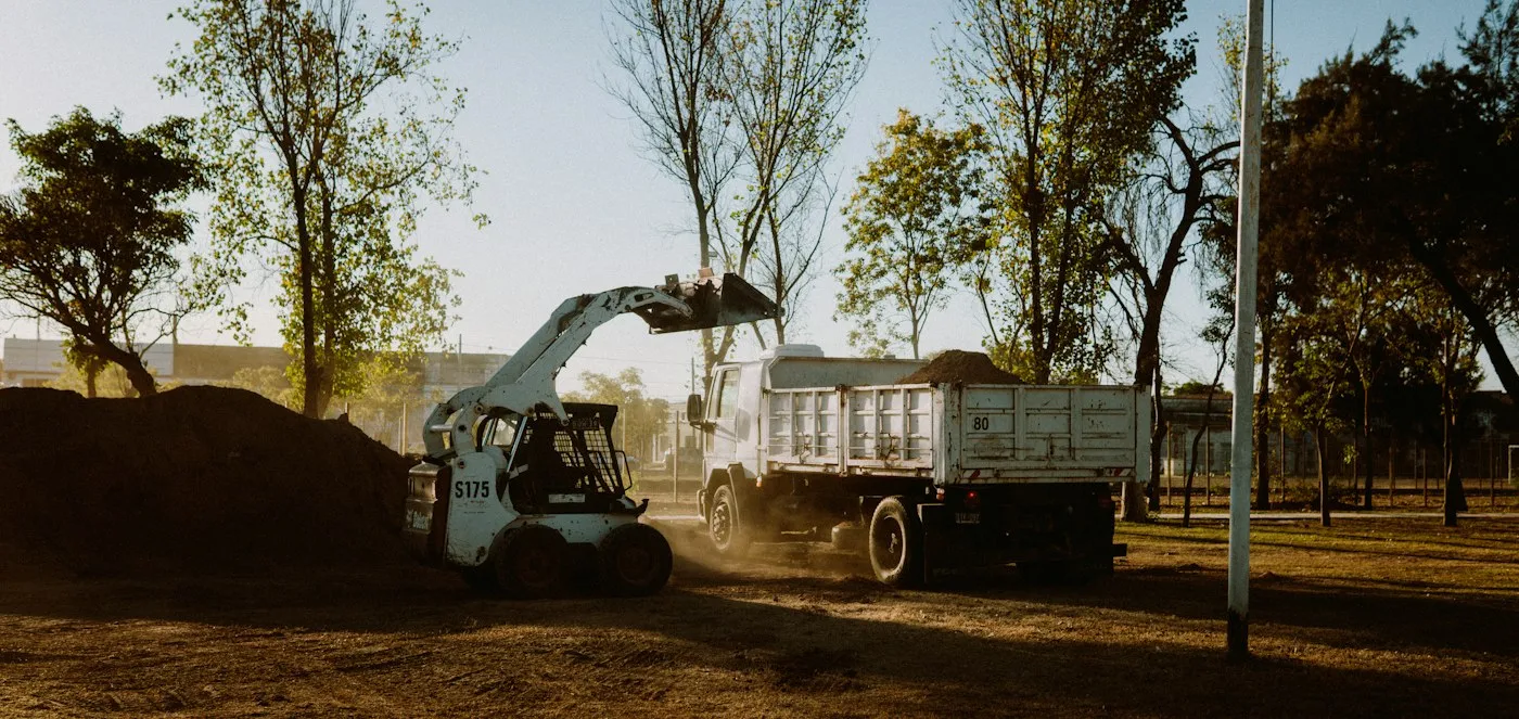 Haul truck on a wooded dirt access route