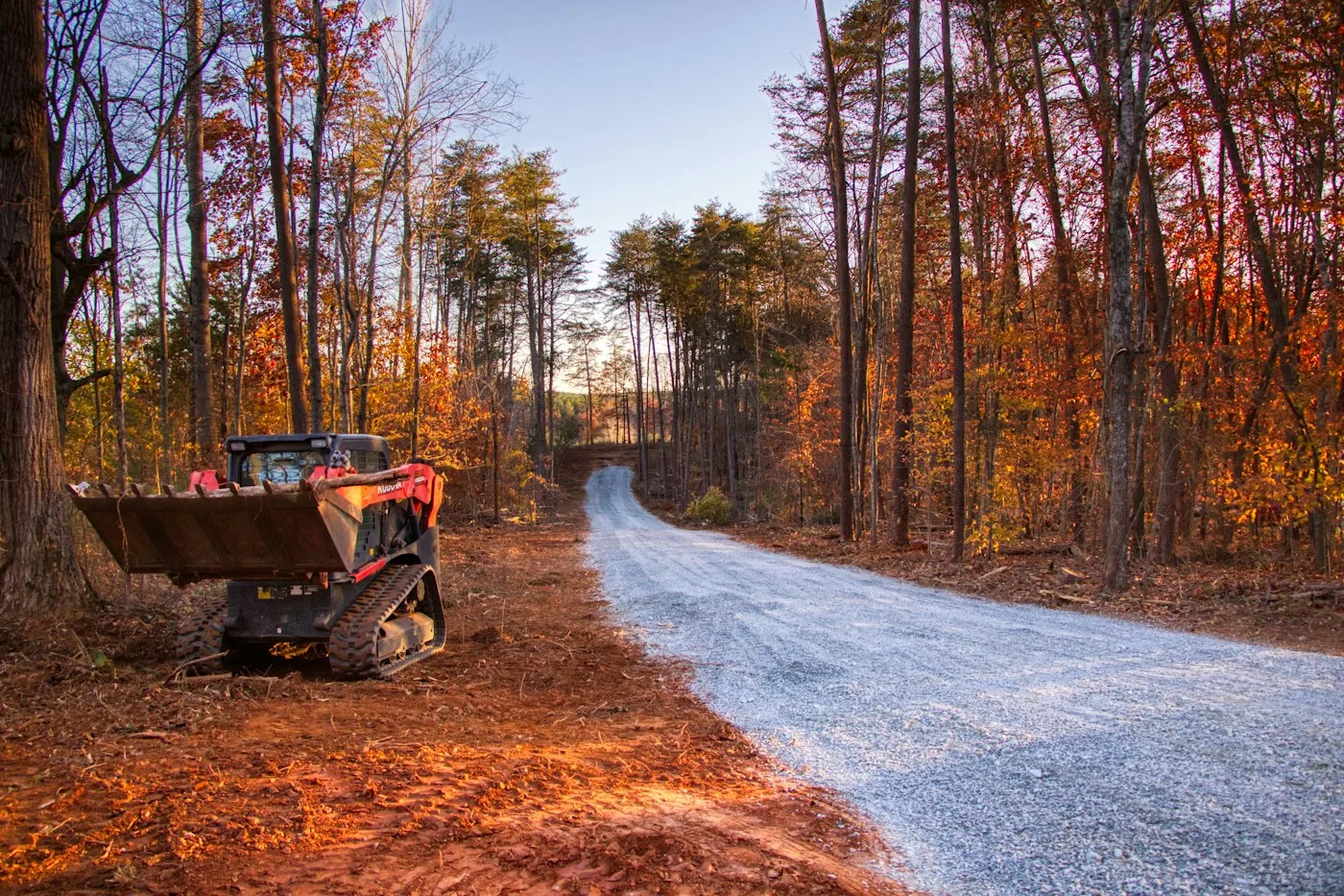 Compact equipment beside a gravel access road